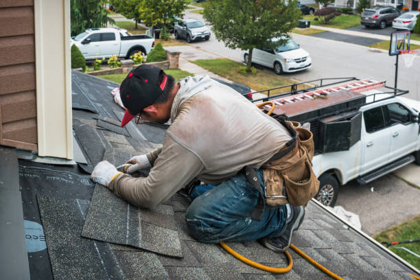 Professional Roof Replacement technician working in Marion, KY